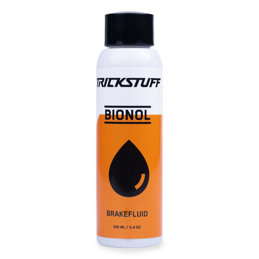 White 100ml bottle of Trickstuff Bionol brake fluid with an orange label and black cap.