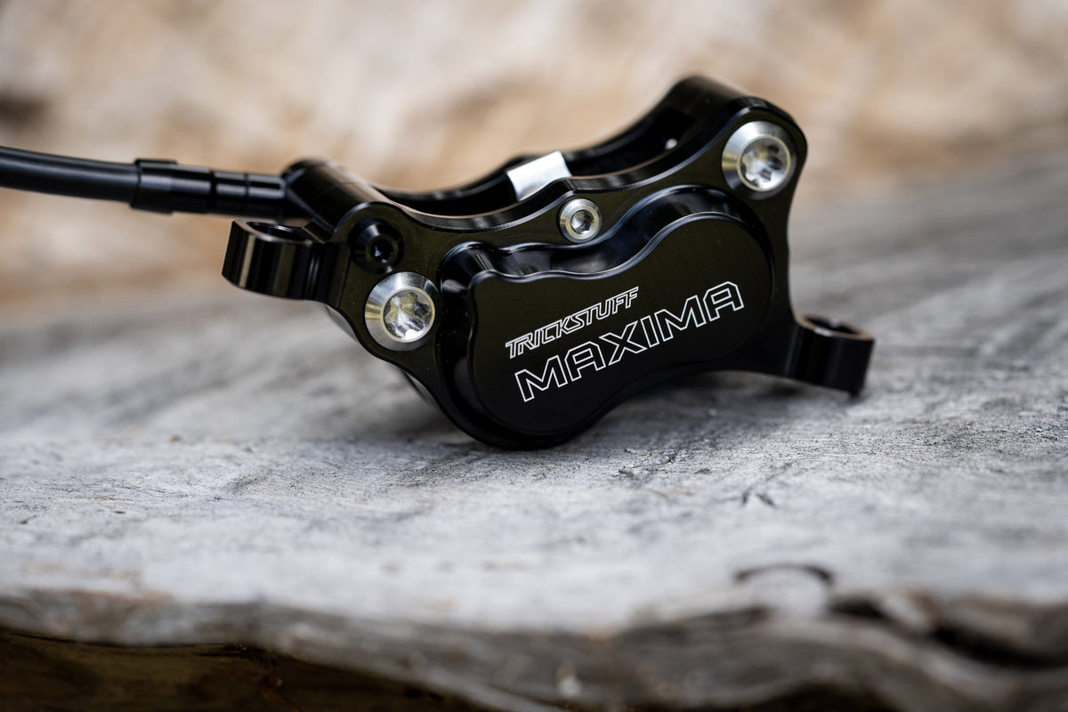 Black Trickstuff Maxima caliper showing the machined body and yoke bolts.