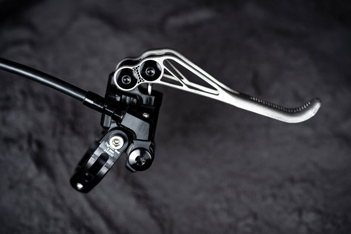 Trickstuff Piccola HD Titanium lever and black pump showing the angled hose fitting.