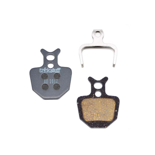 Trickstuff Standard 620 brake pads, showing friction and backing faces with a retaining spring.