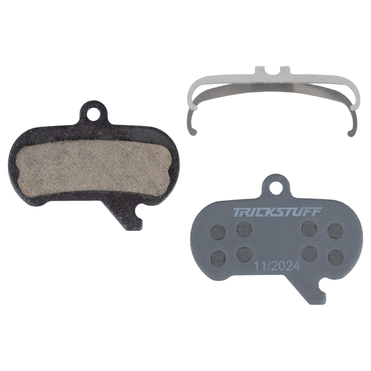 Trickstuff Standard 870 brake pads, showing friction and backing faces with a retaining spring.